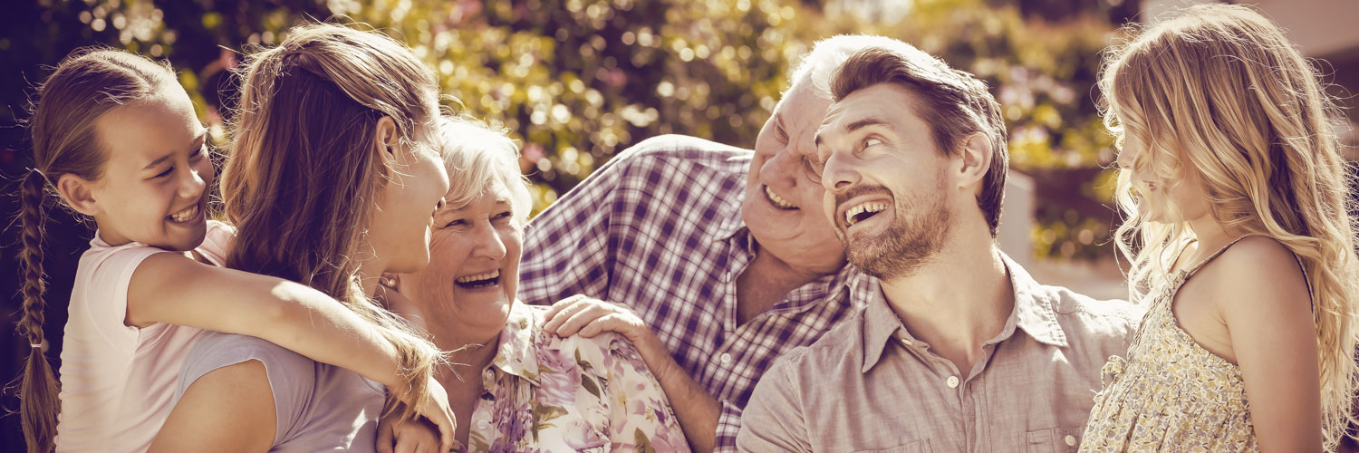 Family laughing in back yard
